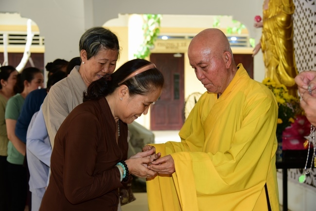 Giving gifts to oncology patients and praying for rebirth in Hoc Mon