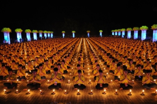   Behind the sacred candles