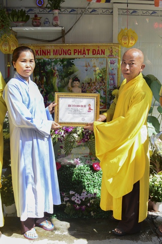 Giving Commendation Paper to those who made Lumbini Garden at Home
