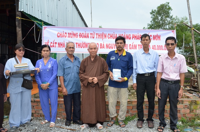 Money giving for supporting house building and animals release in Kien Giang