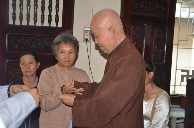 Granting lucky envelop on Tet occasion and handing in a python