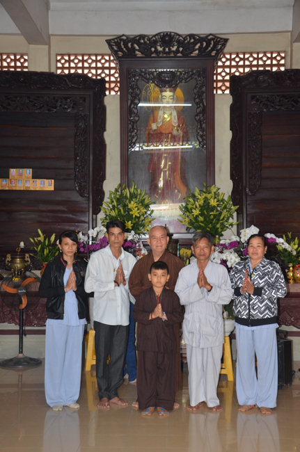 Granting lucky envelop on Tet occasion and handing in a python