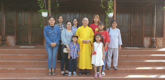 Monks and Buddhists wishing Tet Senior Venerable Thich Chan Tinh on the Tet's 4th day