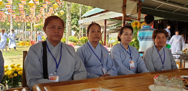 Monks and Buddhists wishing Tet Senior Venerable Thich Chan Tinh on the Tet's 4th day