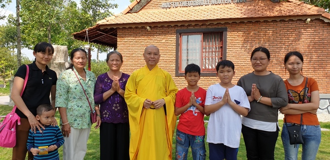 Monks and Buddhists wishing Tet Senior Venerable Thich Chan Tinh on the Tet's 4th day