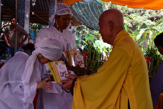 The rite of offering a meal and alms for monks and releasing creatures.