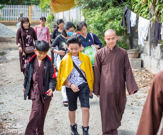 Giving gifts to pupils on occasion preparing Lunar New Year