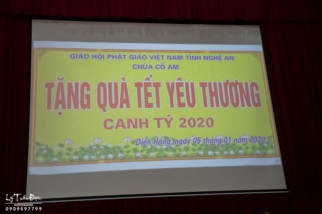 Giving gifts to pupils on occasion preparing Lunar New Year