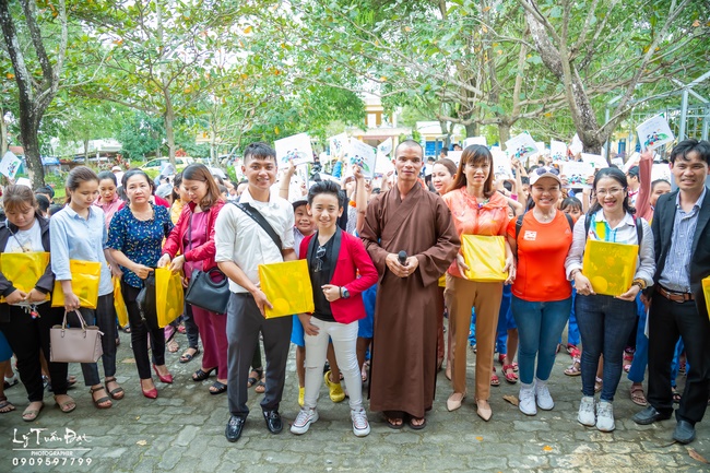 Giving gifts to pupils on occasion preparing Lunar New Year