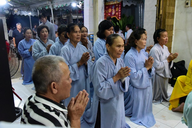 Praying for rebirth in District 11 and Hoc Mon