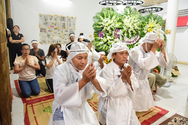 Praying for rebirth in District 11 and Hoc Mon