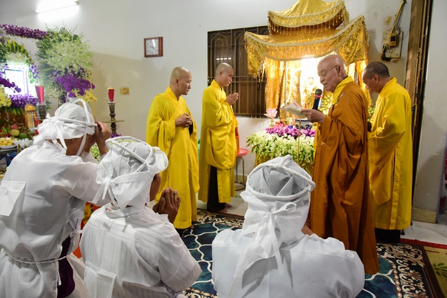 Praying for rebirth in District 11 and Hoc Mon