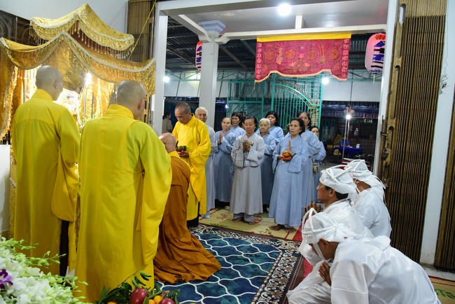 Praying for rebirth in District 11 and Hoc Mon