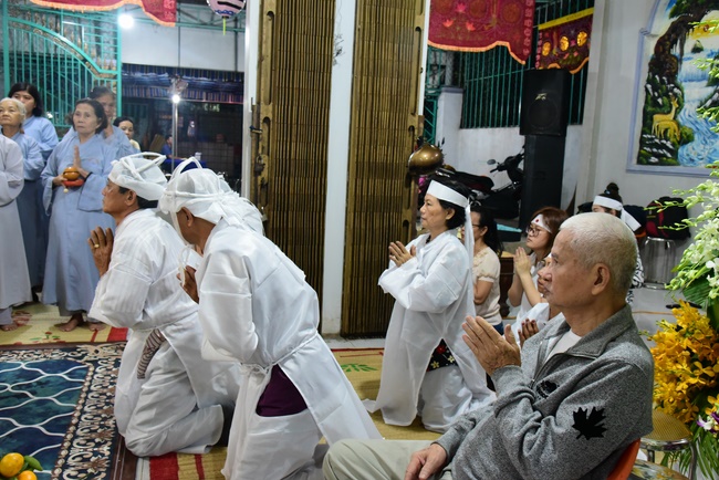 Praying for rebirth in District 11 and Hoc Mon