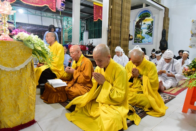 Praying for rebirth in District 11 and Hoc Mon