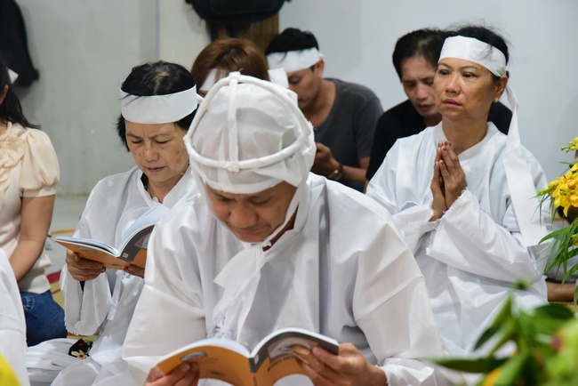 Praying for rebirth in District 11 and Hoc Mon