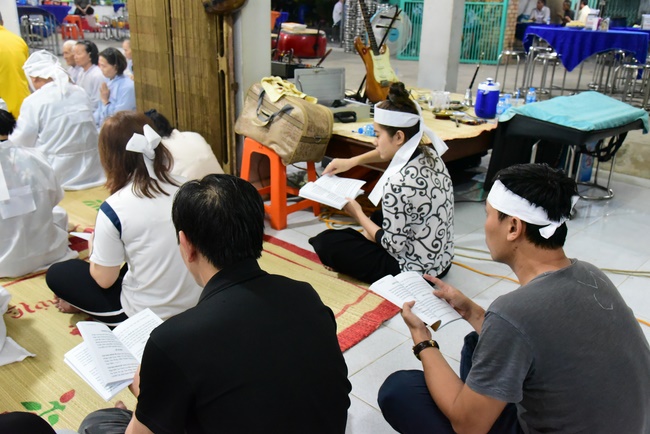 Praying for rebirth in District 11 and Hoc Mon