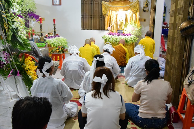 Praying for rebirth in District 11 and Hoc Mon