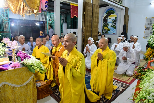 Praying for rebirth in District 11 and Hoc Mon