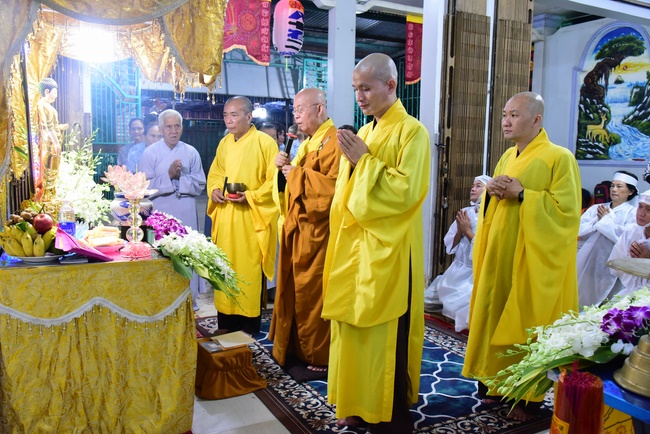 Praying for rebirth in District 11 and Hoc Mon