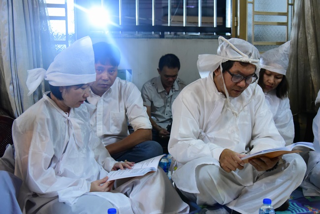 Praying for rebirth in District 11 and Hoc Mon