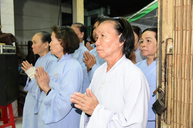 Praying for rebirth in District 11 and Hoc Mon