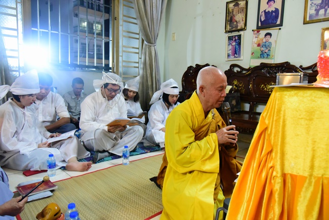 Praying for rebirth in District 11 and Hoc Mon