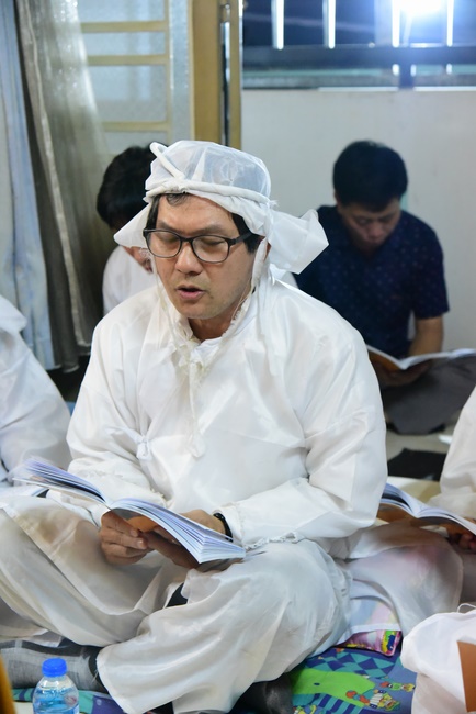 Praying for rebirth in District 11 and Hoc Mon