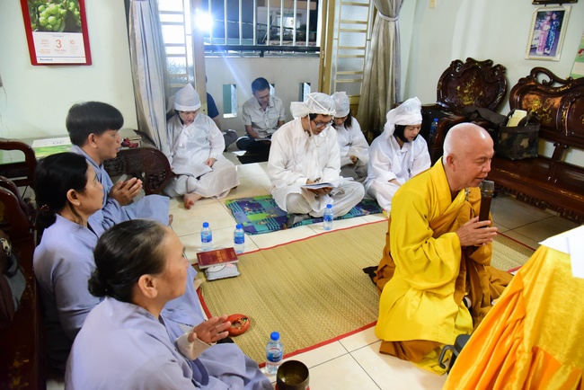 Praying for rebirth in District 11 and Hoc Mon