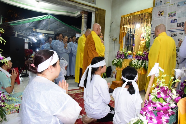 Praying for rebirth in District 11 and Hoc Mon