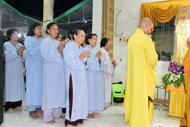 Praying for rebirth in District 11 and Hoc Mon