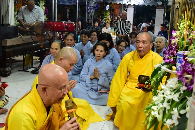 Praying for rebirth in District 11 and Hoc Mon