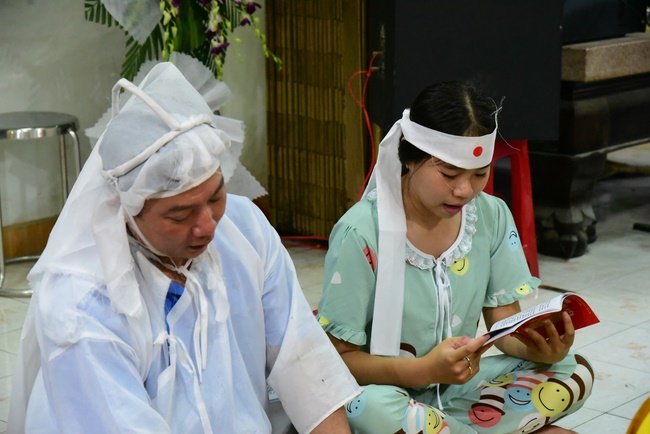 Praying for rebirth in District 11 and Hoc Mon