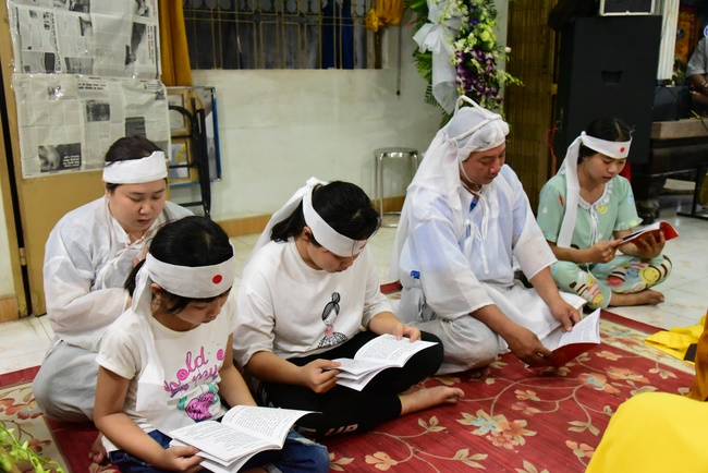 Praying for rebirth in District 11 and Hoc Mon