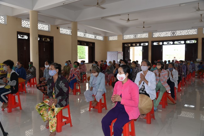 The handover ceremony of saline water purifier and rice ATM machine at Quoc Thoi Pagoda in Ben Tre