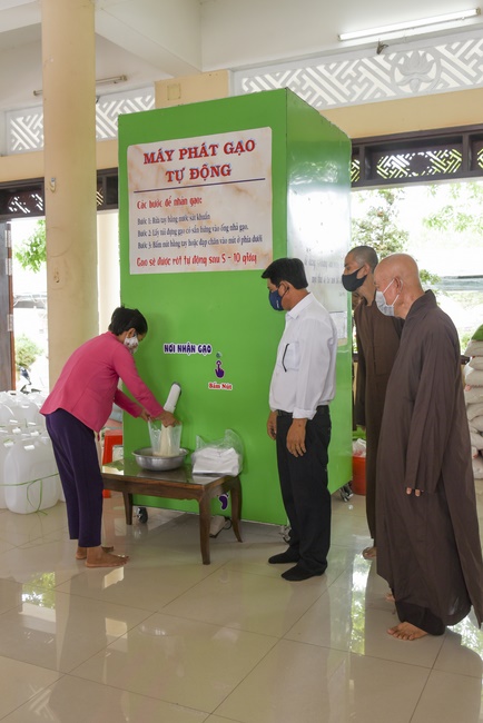 The handover ceremony of saline water purifier and rice ATM machine at Quoc Thoi Pagoda in Ben Tre