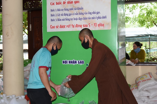 The handover ceremony of saline water purifier and rice ATM machine at Quoc Thoi Pagoda in Ben Tre