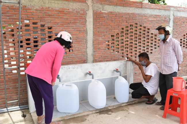 The handover ceremony of saline water purifier and rice ATM machine at Quoc Thoi Pagoda in Ben Tre