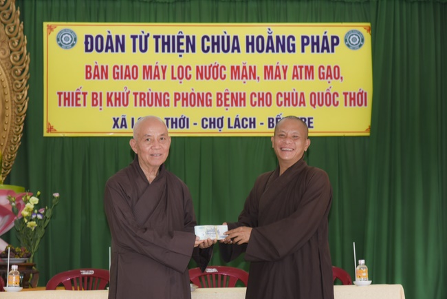 The handover ceremony of saline water purifier and rice ATM machine at Quoc Thoi Pagoda in Ben Tre