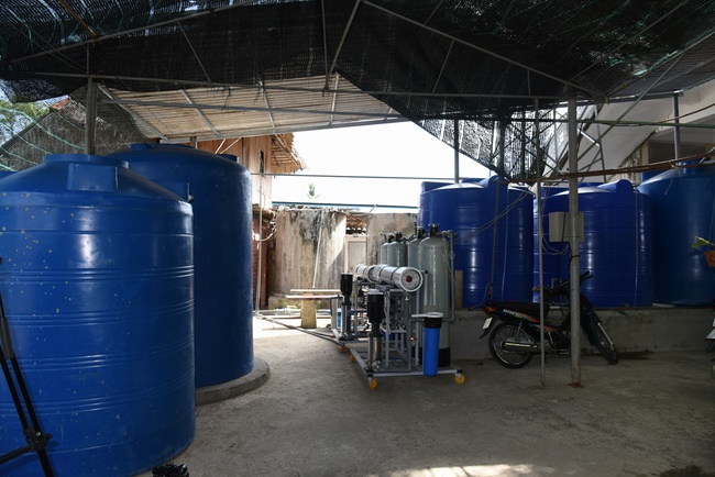 The handover ceremony of saline water purifier and rice ATM machine at Quoc Thoi Pagoda in Ben Tre