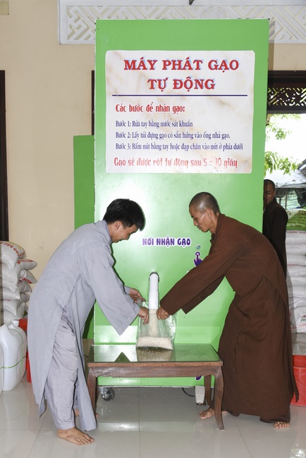 The handover ceremony of saline water purifier and rice ATM machine at Quoc Thoi Pagoda in Ben Tre