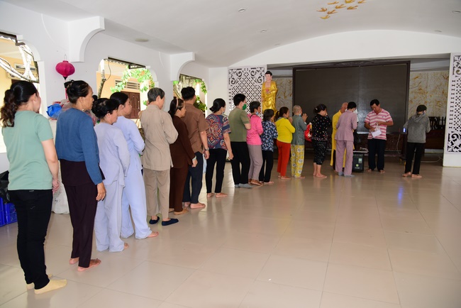 Giving gifts to oncology patients and praying for rebirth in Hoc Mon