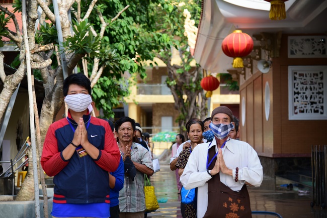 Giving gifts to oncology patients and praying for rebirth in Hoc Mon