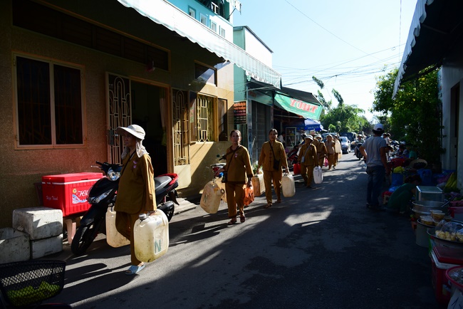 Offering money to build wells at Bao Phap Pagoda, Lam Dong