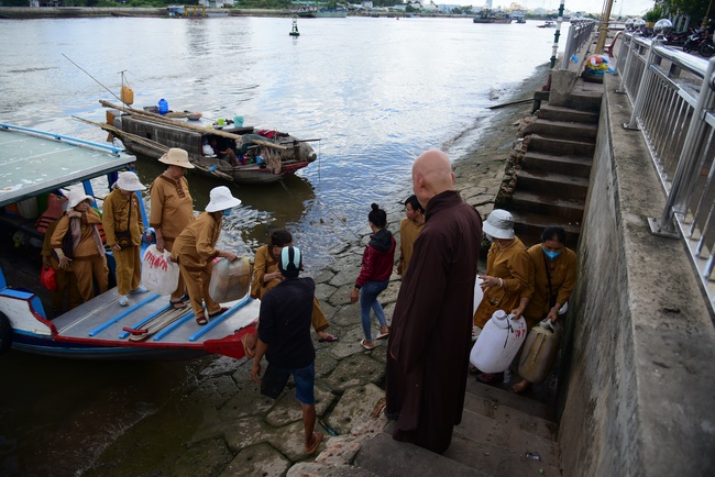 Offering money to build wells at Bao Phap Pagoda, Lam Dong