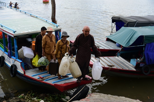 Offering money to build wells at Bao Phap Pagoda, Lam Dong