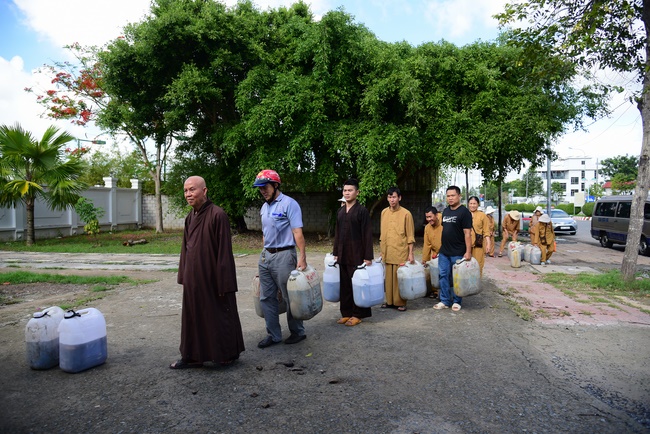 Offering money to build wells at Bao Phap Pagoda, Lam Dong