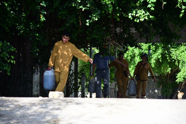 Offering money to build wells at Bao Phap Pagoda, Lam Dong