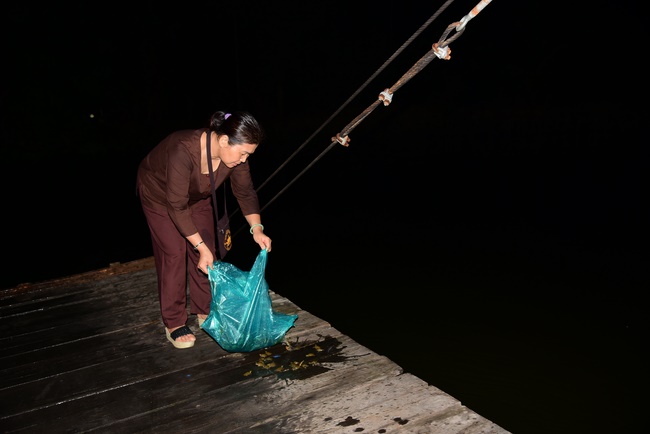 Liberating creatures at Binh My ferry and praying for peacefulness.