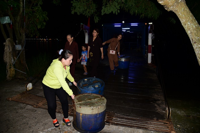 Liberating creatures at Binh My ferry and praying for peacefulness.
